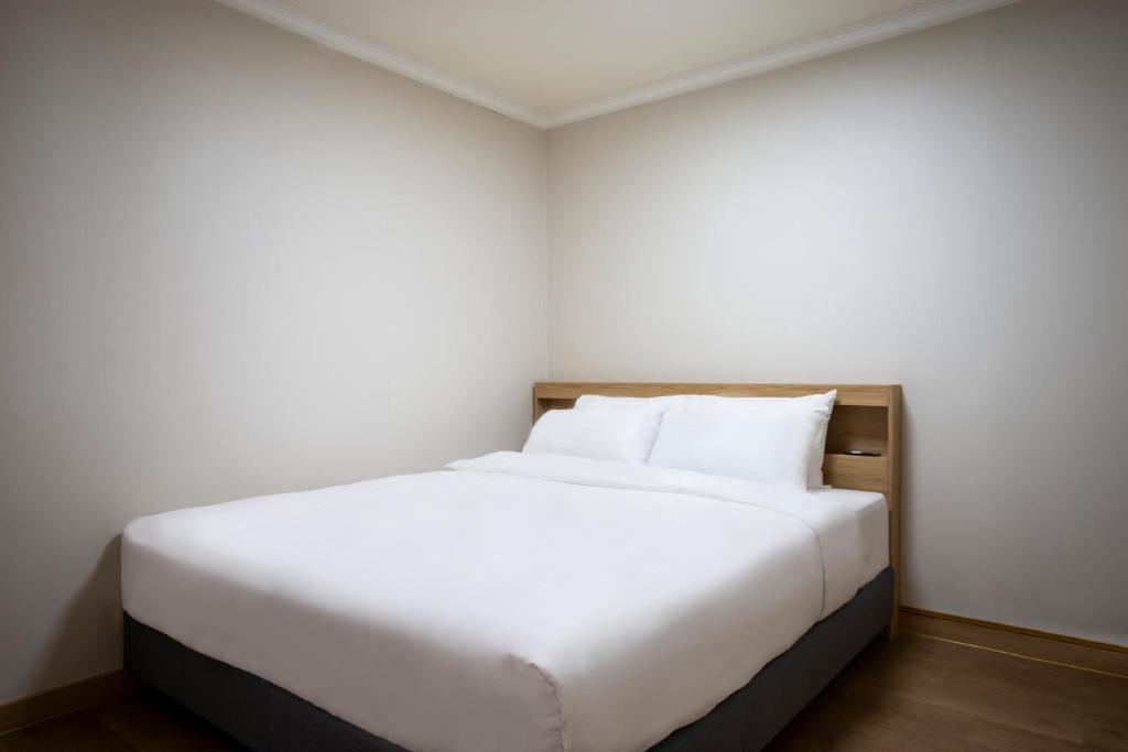 Postel nebo postele na pokoji v ubytování Kensington Resort Gapyeong