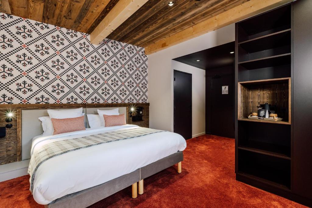 Postel nebo postele na pokoji v ubytování Hôtel Névé