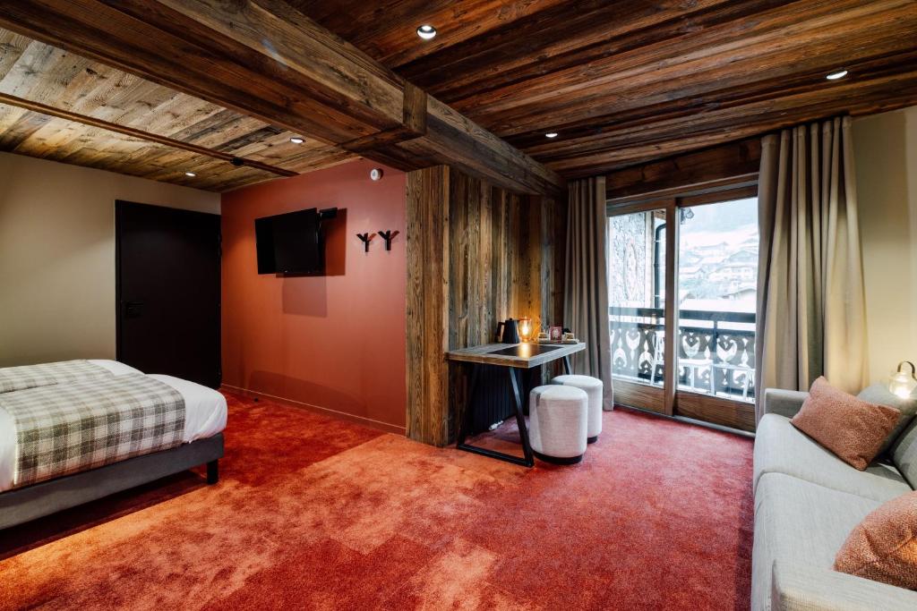 Postel nebo postele na pokoji v ubytování Hôtel Névé