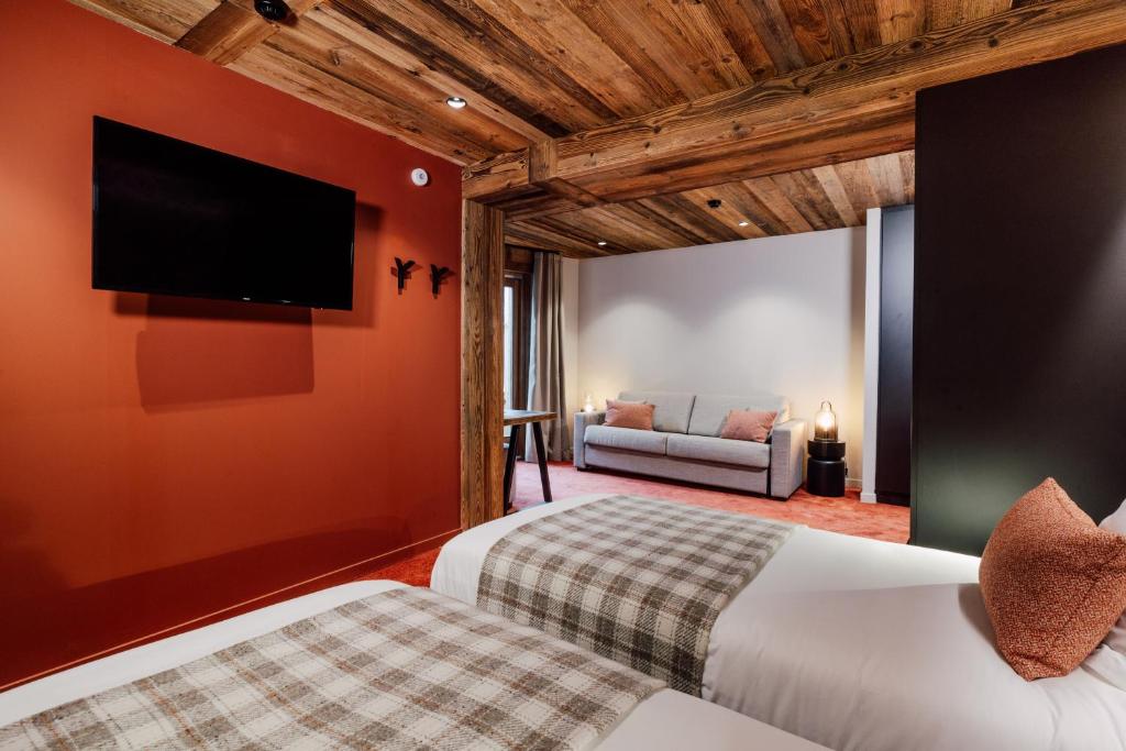 Postel nebo postele na pokoji v ubytování Hôtel Névé
