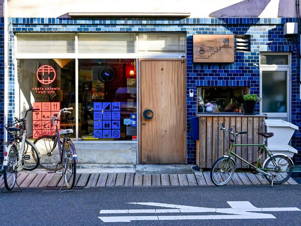 two bikes parked in front of a store at Kawaramachi Domitory in Takamatsu