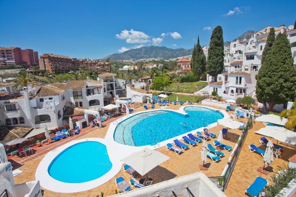 an aerial view of a swimming pool in a resort at Pueblo Evita in Benalmádena