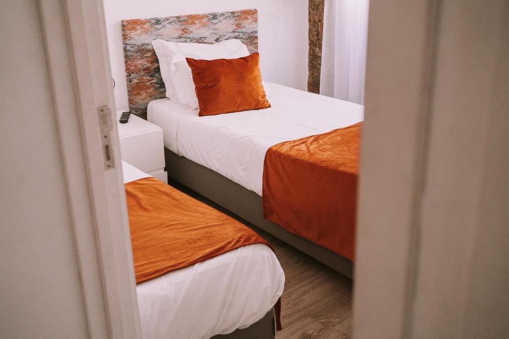 Postel nebo postele na pokoji v ubytování Top'Otel