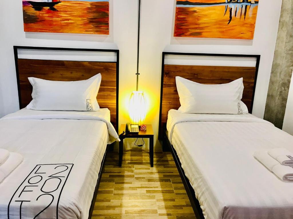 Postel nebo postele na pokoji v ubytování Loft 202 Hotel