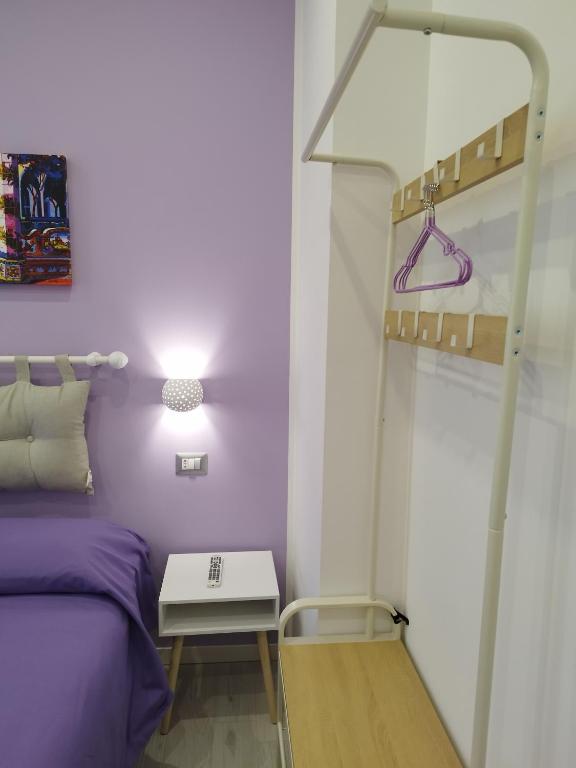 Łóżko lub łóżka w pokoju w obiekcie B&B Molo Partenope
