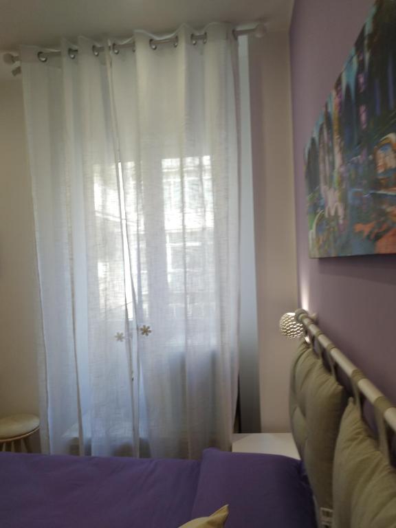 Łóżko lub łóżka w pokoju w obiekcie B&B Molo Partenope