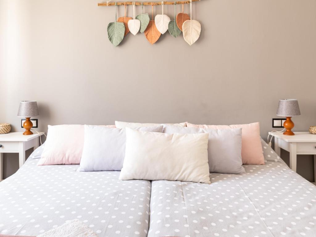 A bed or beds in a room at La Casa de Estrella