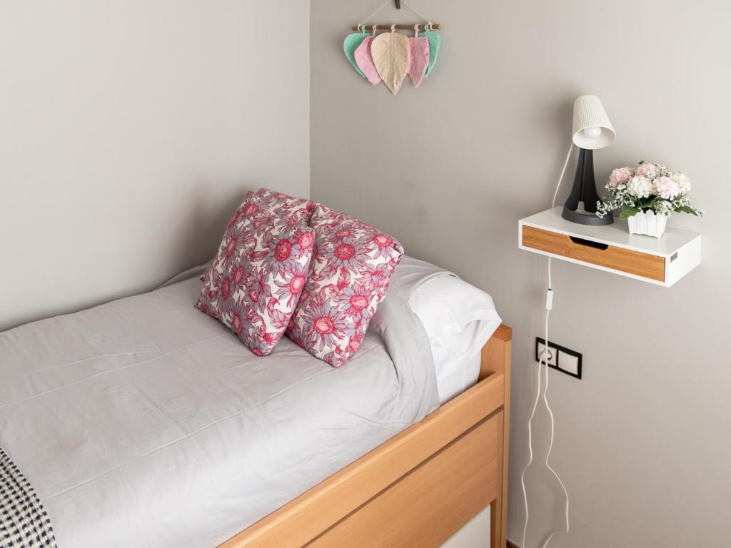A bed or beds in a room at La Casa de Estrella