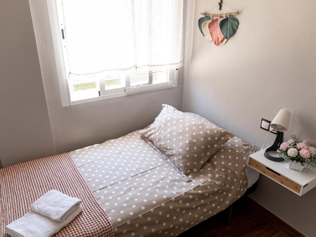 A bed or beds in a room at La Casa de Estrella