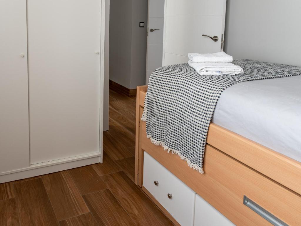 A bed or beds in a room at La Casa de Estrella