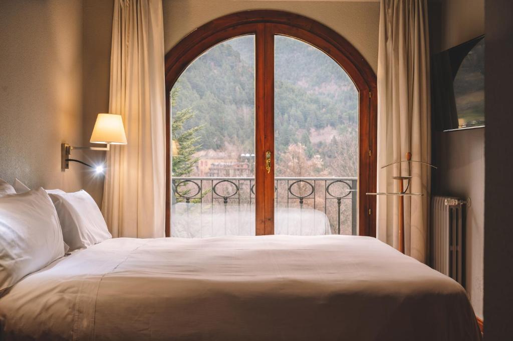 Postel nebo postele na pokoji v ubytování Abba Xalet Suites Hotel