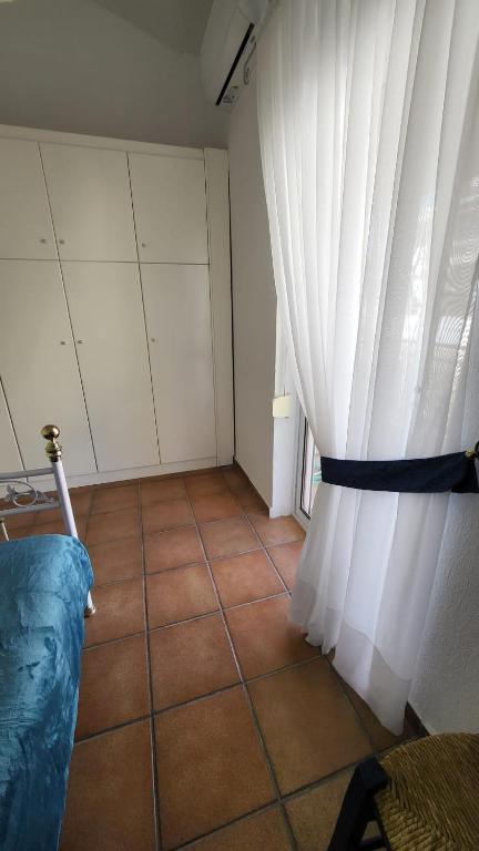 Postel nebo postele na pokoji v ubytování Mina House Siviri