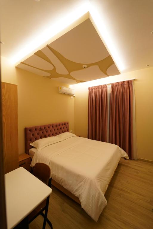 Postel nebo postele na pokoji v ubytování SR99 Hotel