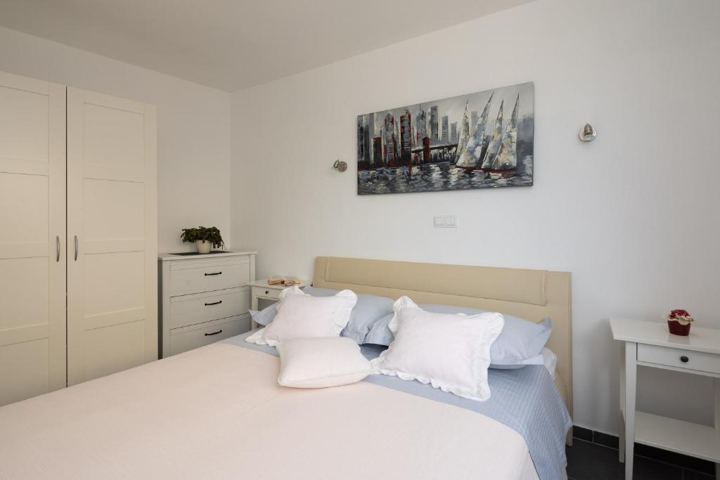 Postel nebo postele na pokoji v ubytování Seaside Apartment Kamelia