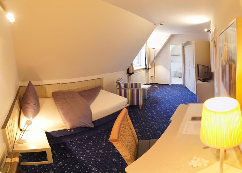 Postel nebo postele na pokoji v ubytování Gästehaus Brinks