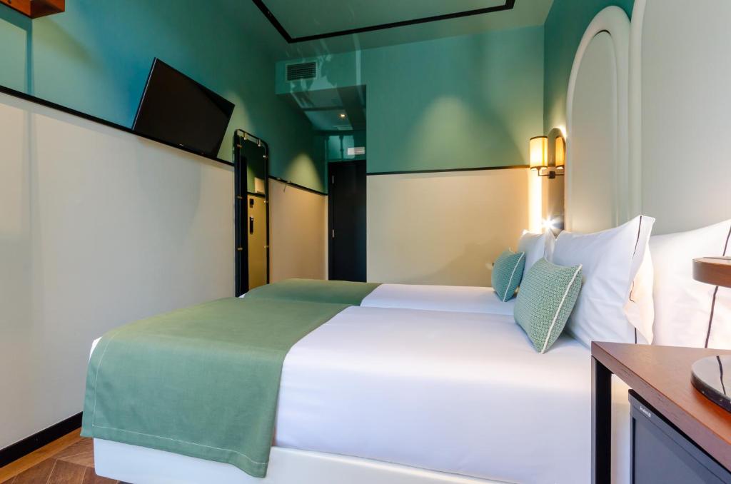 Nicola Rossio Hotelにあるベッド