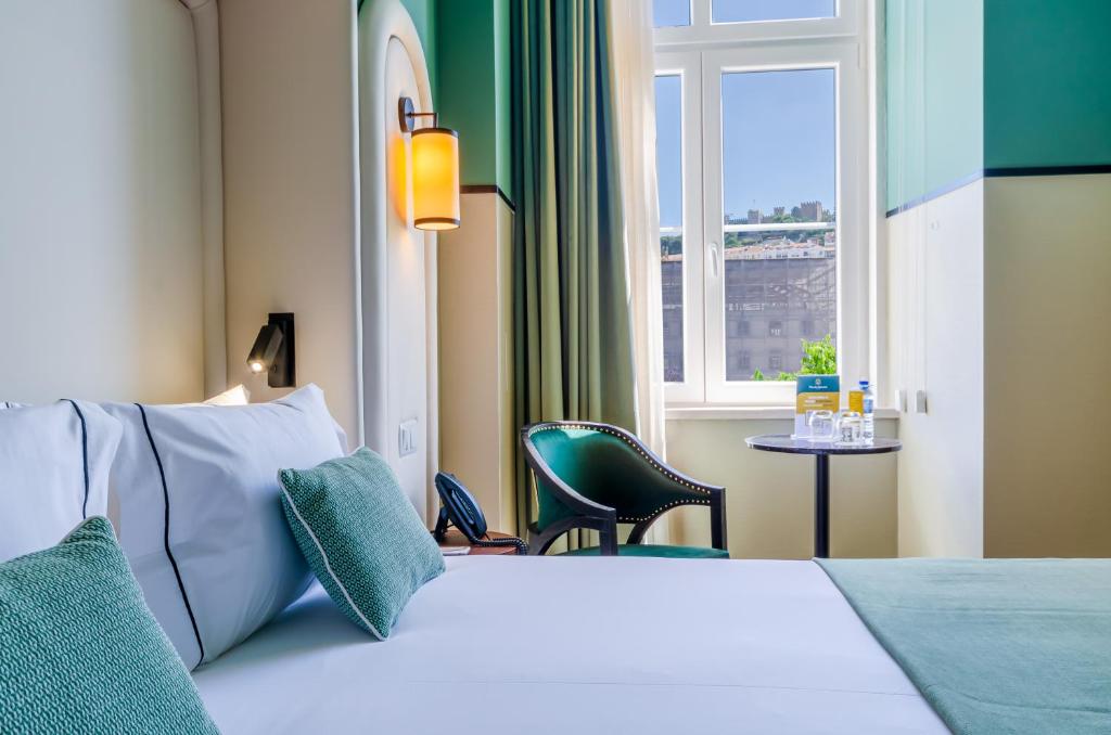 Nicola Rossio Hotelにあるベッド