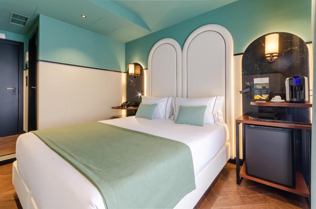 Nicola Rossio Hotelにあるベッド