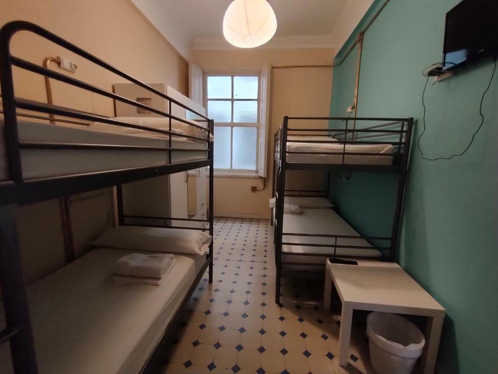 Postel nebo postele na pokoji v ubytování Zentric Hostel