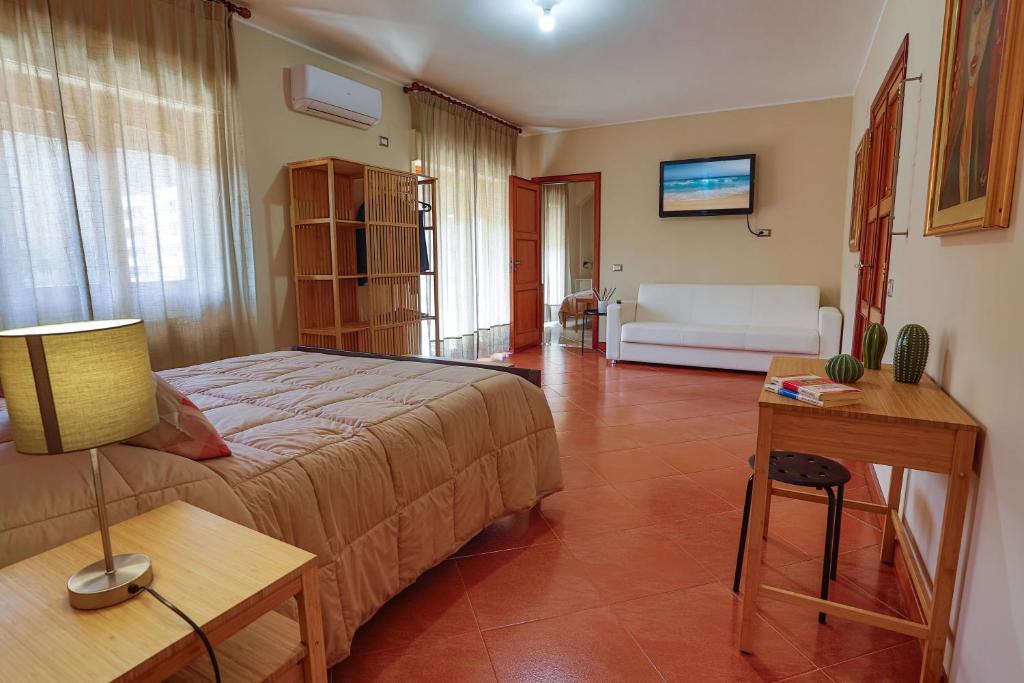 Postel nebo postele na pokoji v ubytování B&B CasaBuddace