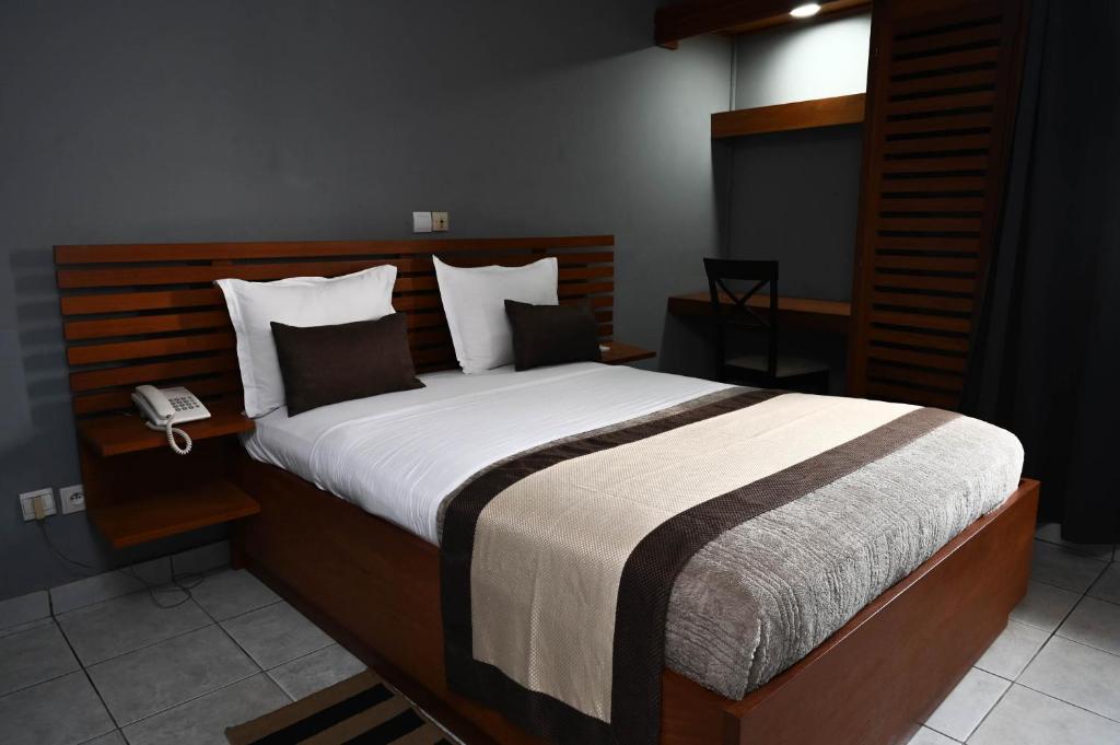 Postel nebo postele na pokoji v ubytování Hotel Astoria