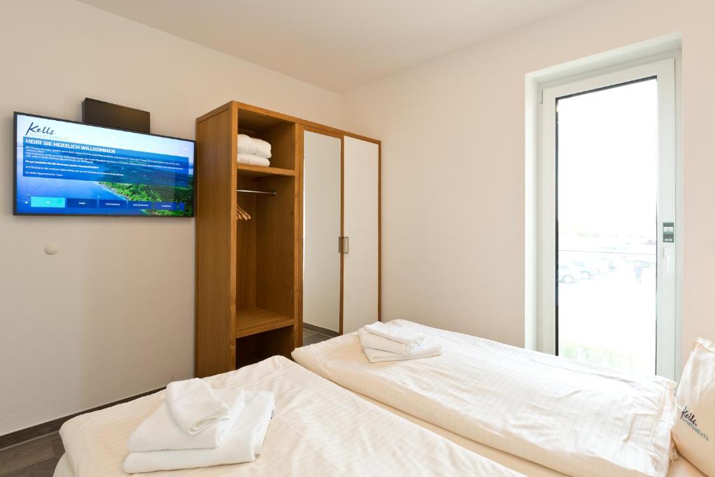 Postel nebo postele na pokoji v ubytování Kells Appartements