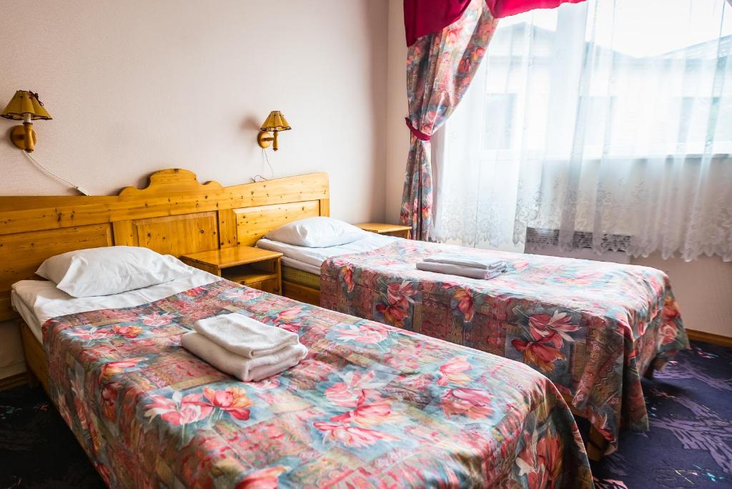 Postel nebo postele na pokoji v ubytování Lõokese Hotell