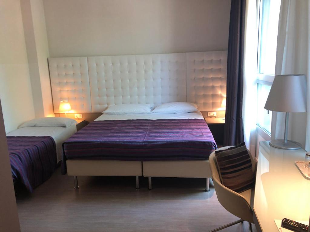 Posteľ alebo postele v izbe v ubytovaní Hotel Lugano Torretta