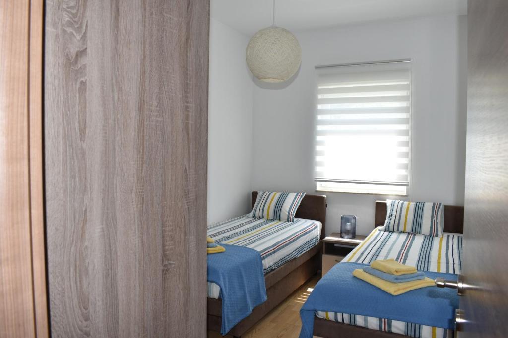 Posteľ alebo postele v izbe v ubytovaní Apartment Vapor