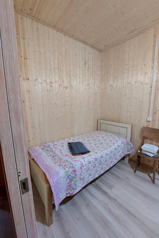 Postel nebo postele na pokoji v ubytování Nikortsminda Holiday House