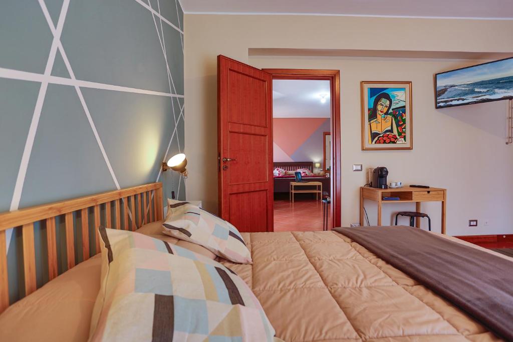 Postel nebo postele na pokoji v ubytování B&B CasaBuddace