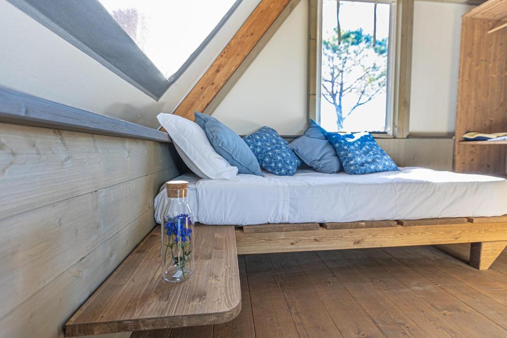 Postel nebo postele na pokoji v ubytování Glamping Gli Etruschi