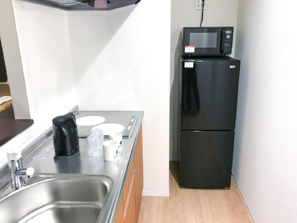 Kuchyň nebo kuchyňský kout v ubytování HOTEL LiVEMAX Takamatsu Eki Mae