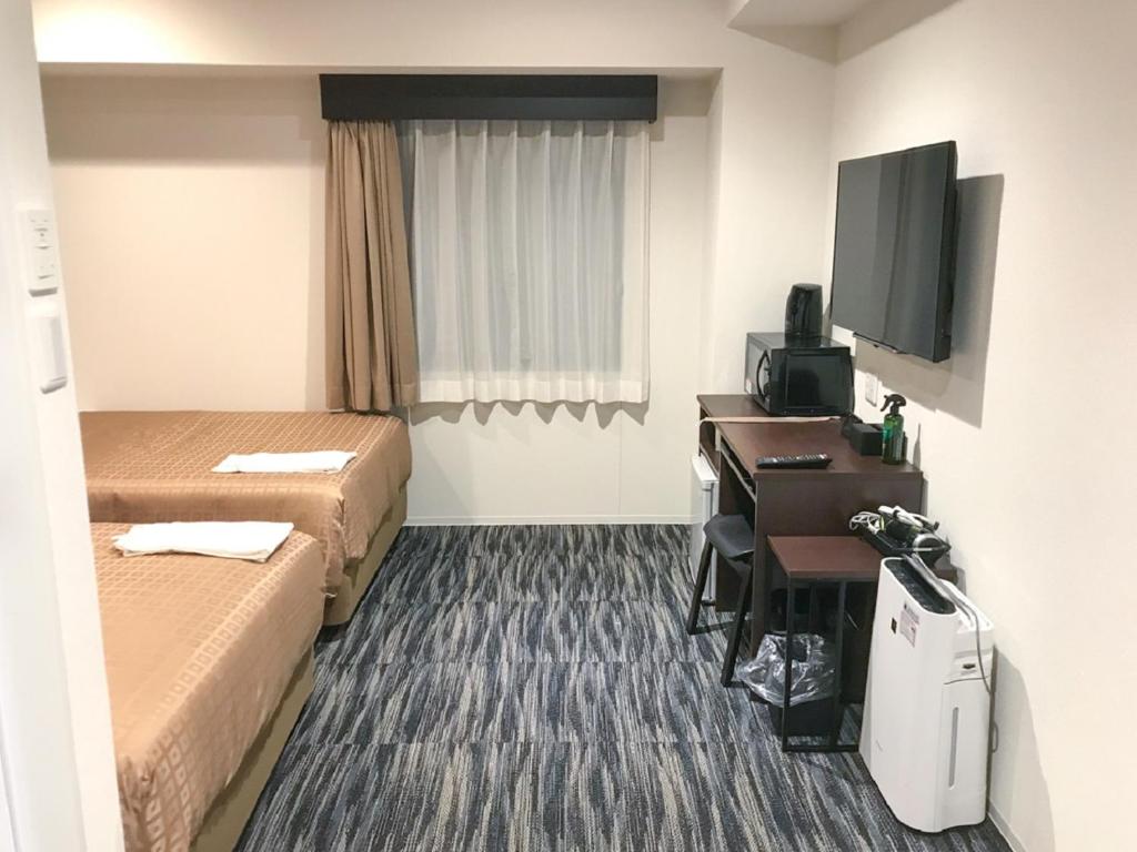 TV a/nebo společenská místnost v ubytování HOTEL LiVEMAX Takamatsu Eki Mae
