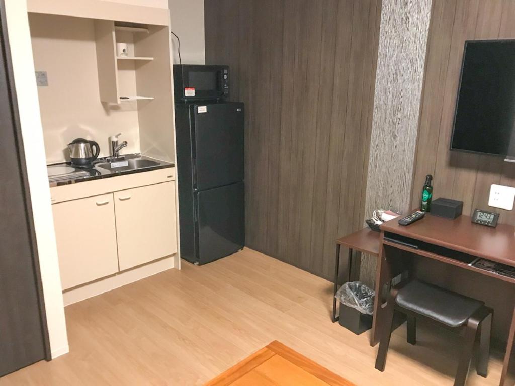 Kuchyň nebo kuchyňský kout v ubytování HOTEL LiVEMAX Takamatsu Eki Mae