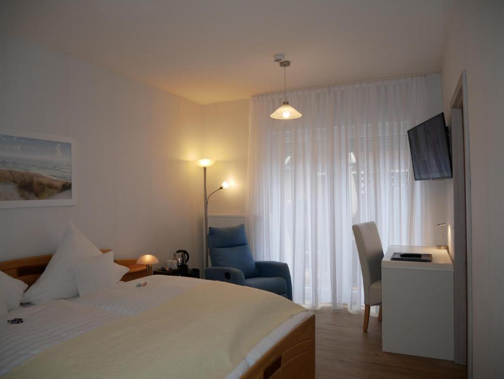 Un pat sau paturi într-o cameră la Hotel Thule