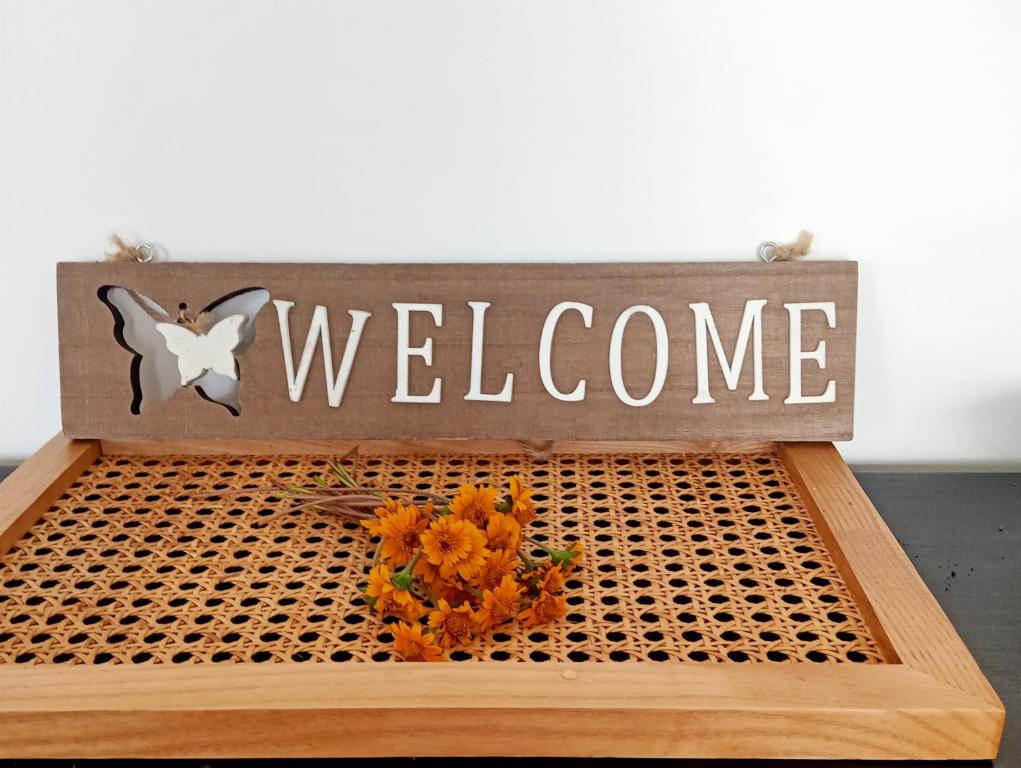 a welcome sign with a bunch of flowers on a table at Cloud9 bnb kericho in Kericho