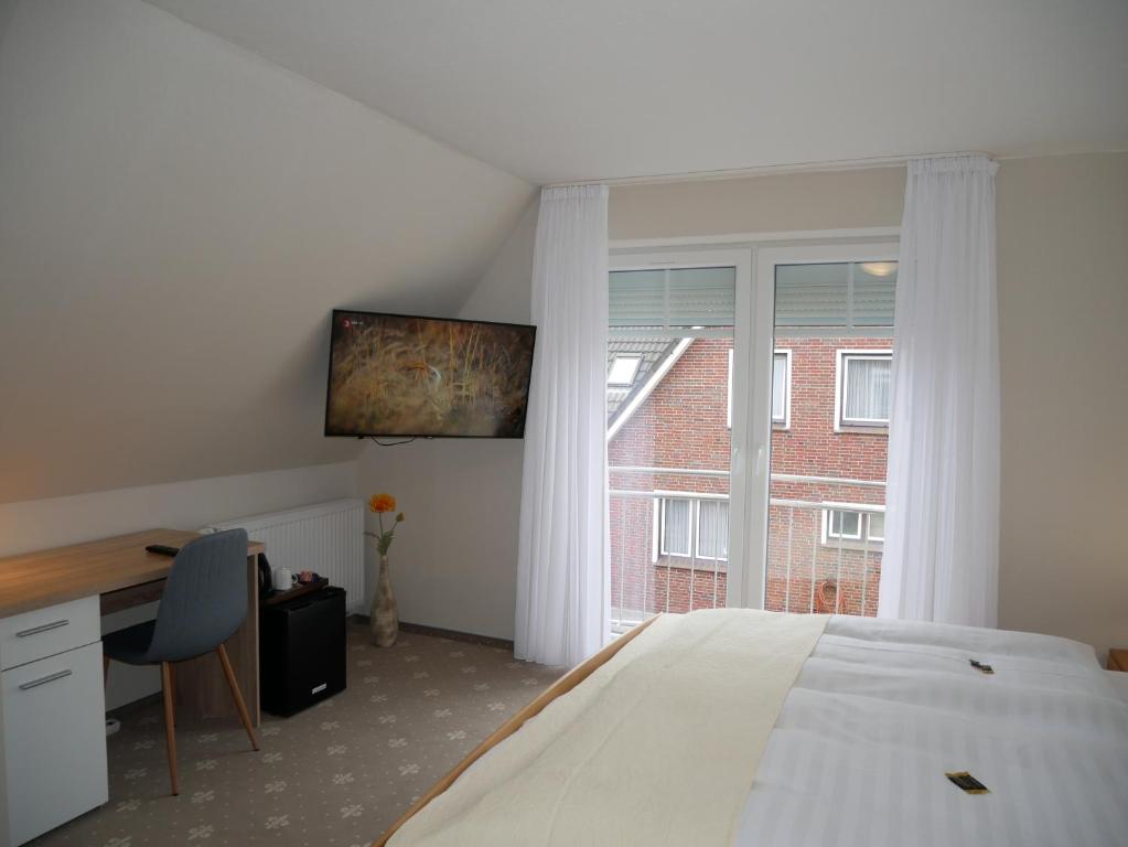 Postel nebo postele na pokoji v ubytování Hotel Thule