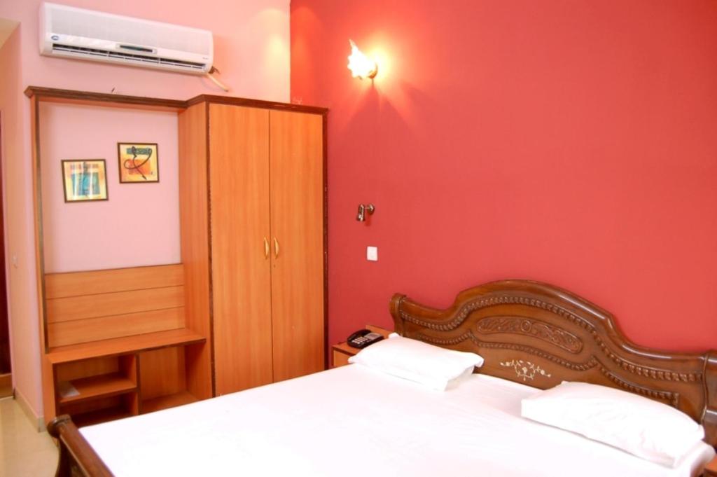 Postel nebo postele na pokoji v ubytování Hotel D R International