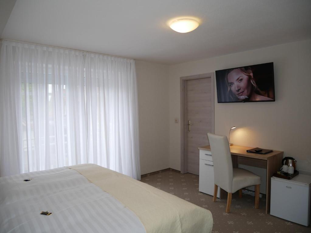 Postel nebo postele na pokoji v ubytování Hotel Thule