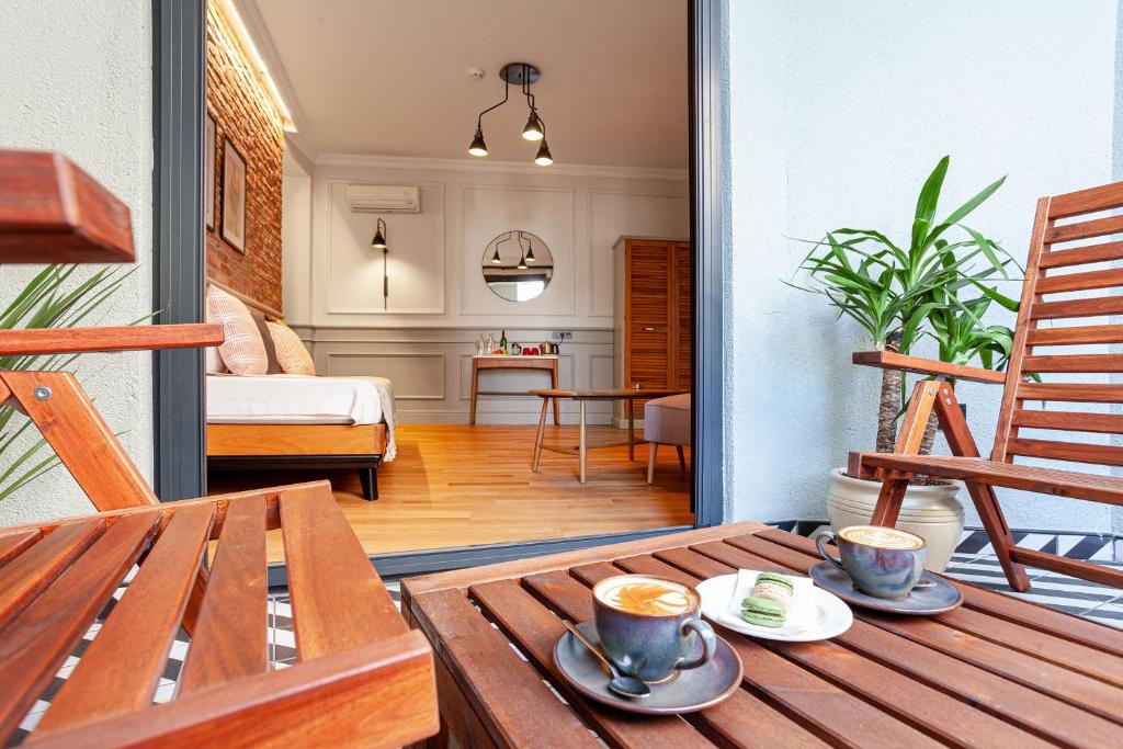 a room with a table and two cups of coffee at World House Boutique Hotel Galata in Istanbul