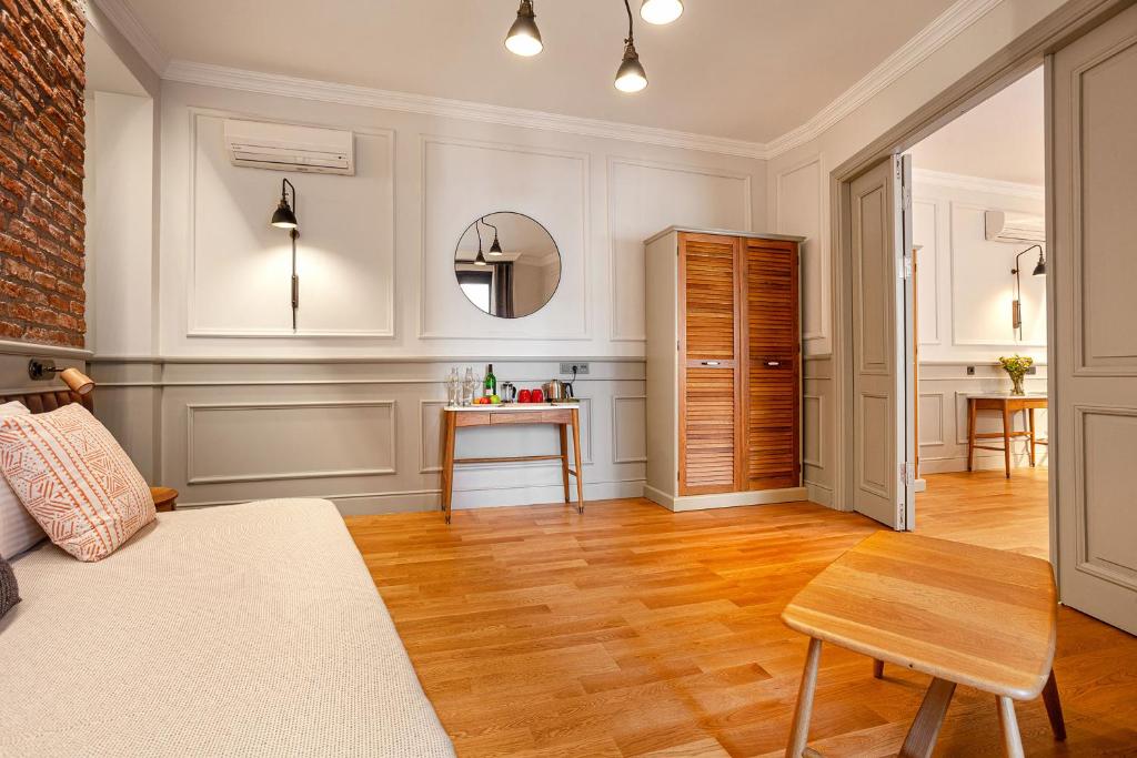 a living room with a couch and a table at World House Boutique Hotel Galata in Istanbul