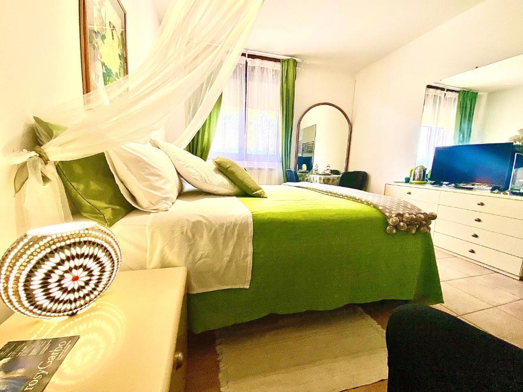 A bed or beds in a room at GARDEN OF VENICE