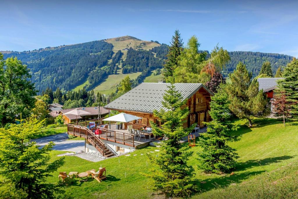 an aerial view of a log house in the mountains at Chalet Joux Verte - OVO Network in Les Gets