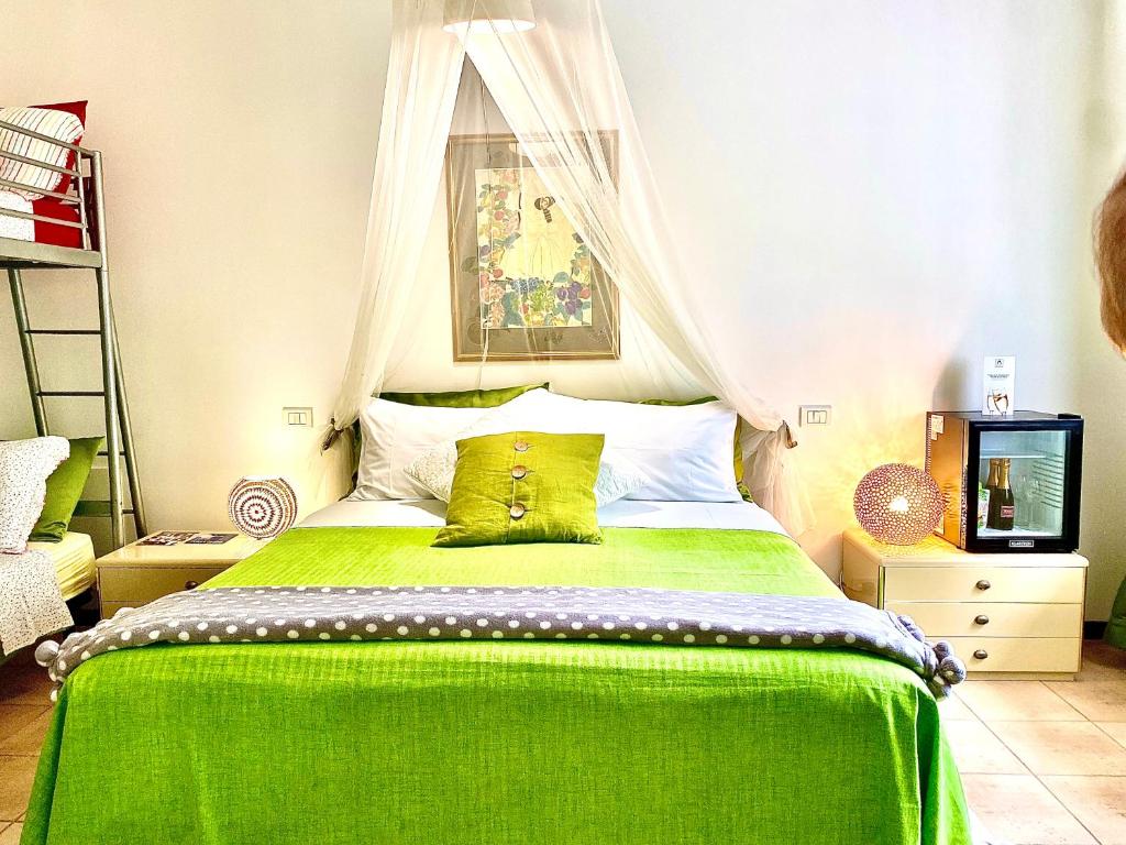 A bed or beds in a room at GARDEN OF VENICE