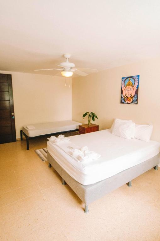 Voodi või voodid majutusasutuse Bodhi Panama City toas