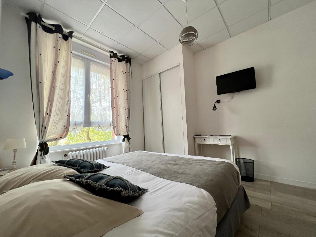 Postel nebo postele na pokoji v ubytování Les Camelias