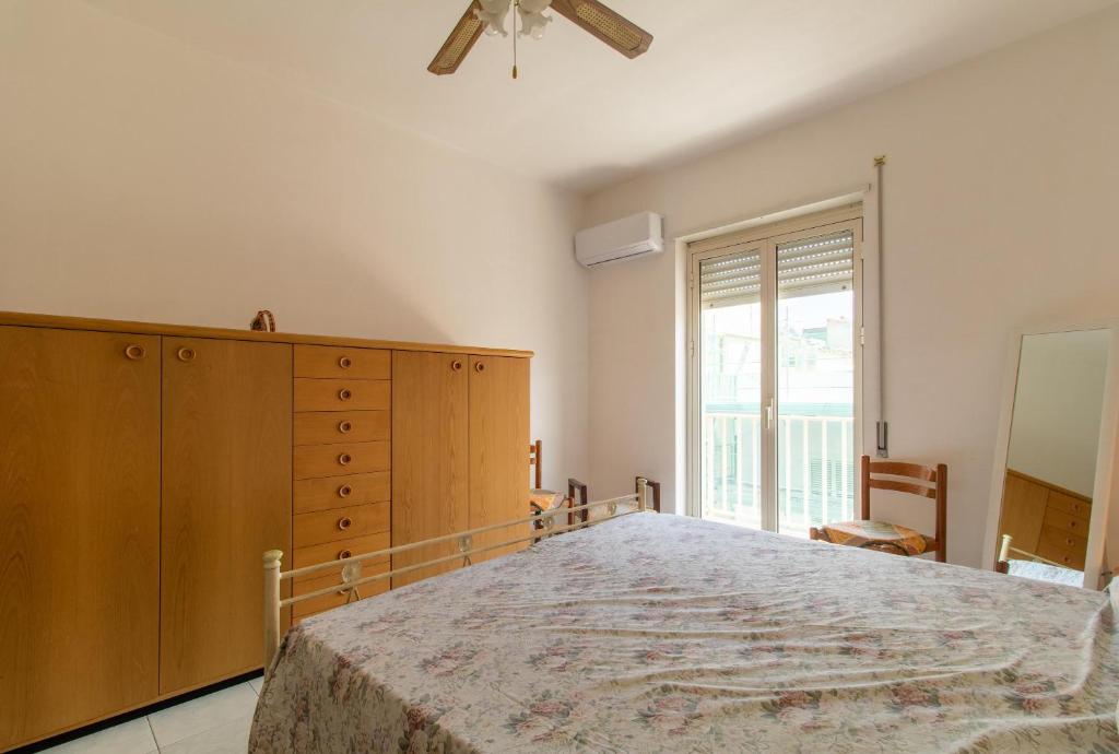 Posteľ alebo postele v izbe v ubytovaní Appartamento vicino al mare