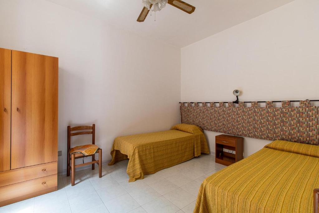 Posteľ alebo postele v izbe v ubytovaní Appartamento vicino al mare