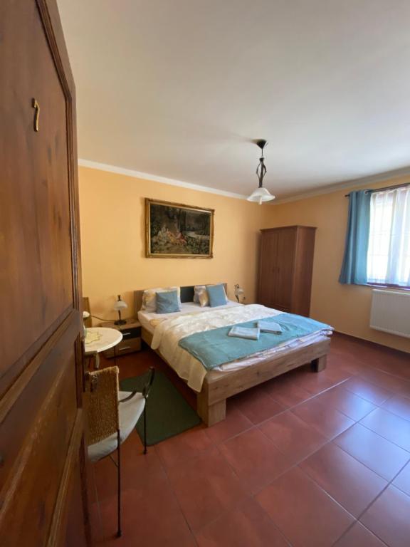 Postel nebo postele na pokoji v ubytování Penzion Albatros